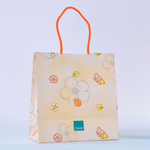 white kraft paper bag with paper core handles